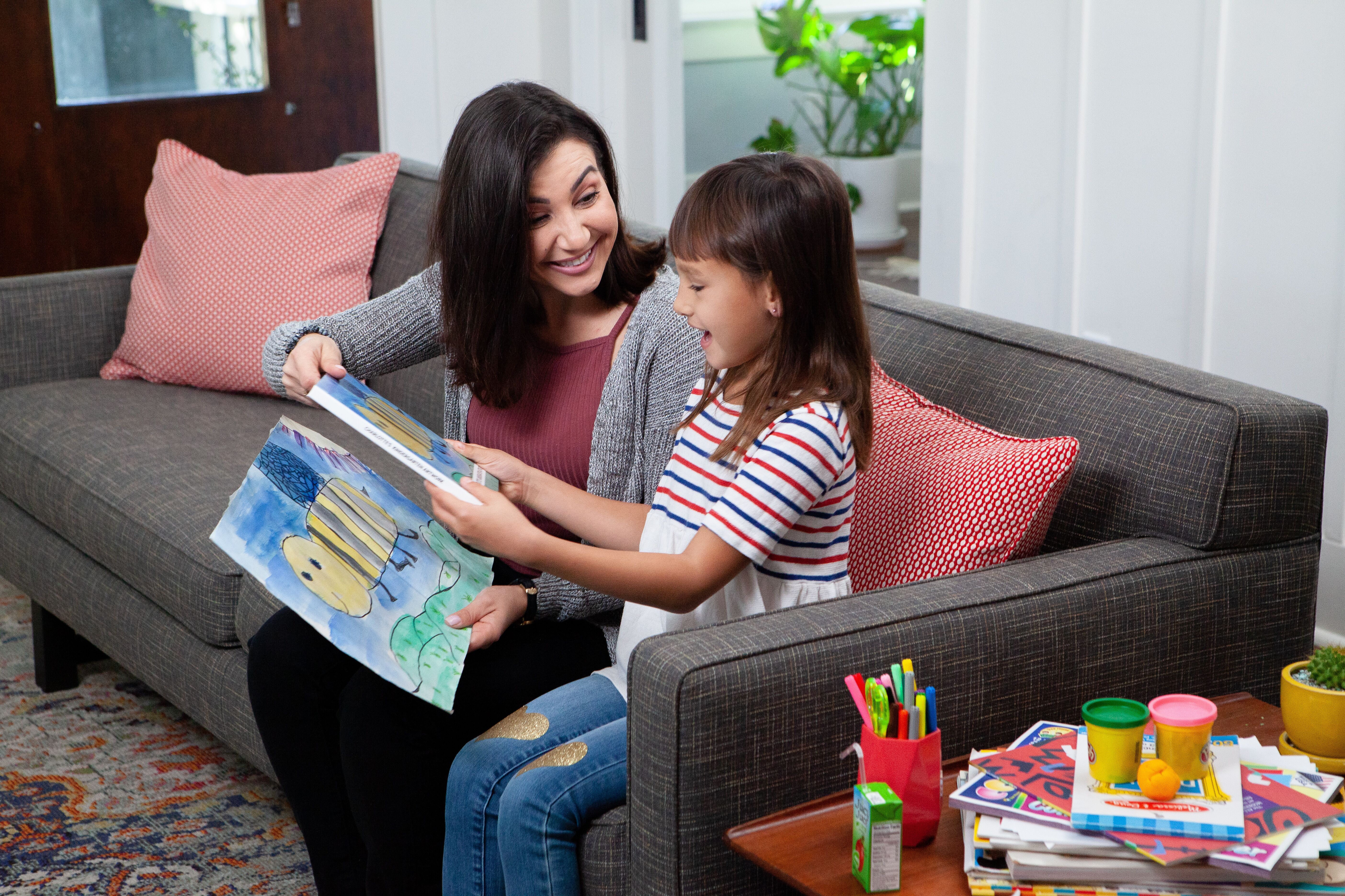 girl_and_mom_with_book.jpeg
